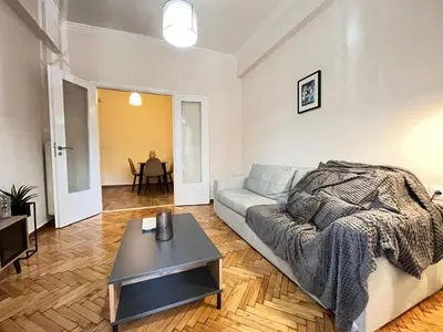 a living room with a couch and a table at Cozy apartment in Athens in Athens