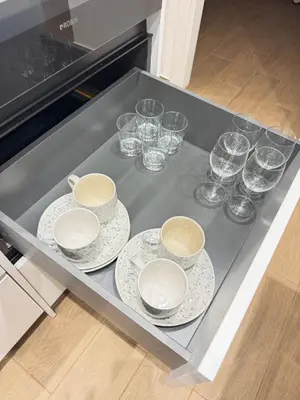 a tray with plates and glasses on top of a stove at Athens Pulse in Athens