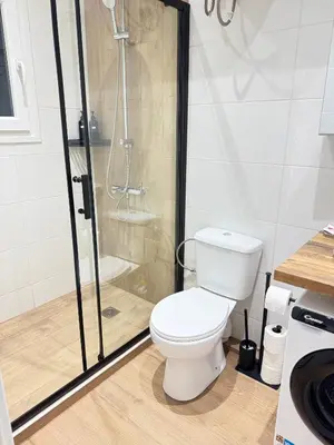 a bathroom with a toilet and a shower at Athens Pulse in Athens