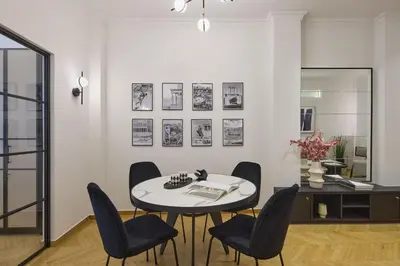 a dining room with a table and chairs at The Athenian Chic Elegant Apartments in Kolonaki in Athens