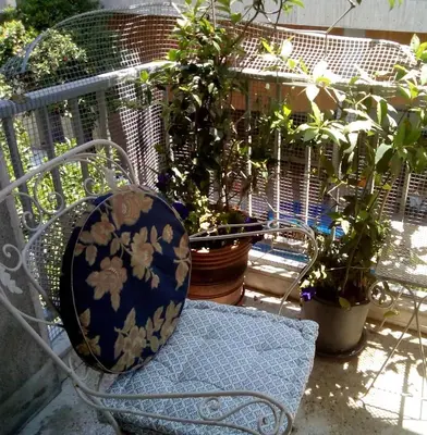 a blue and white bowl sitting on a bench with potted plants at Super Central-Acropolis Museum- Metro , 75 m2 in Athens