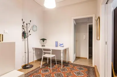 a white desk with a chair in a room at Super Central-Acropolis Museum- Metro , 75 m2 in Athens