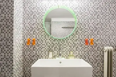 a bathroom with a white sink and a mirror at Super Central-Acropolis Museum- Metro , 75 m2 in Athens