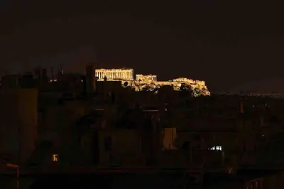a view of a city at night at Penthouse! Best views Lycabetous & Parthenon ! EXARCHEIA in Athens