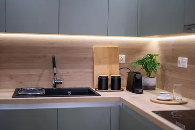 a kitchen counter with a sink and a coffee maker at LIV - Marvelous Apartment Near Acropolis in Athens