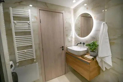 a bathroom with a sink and a mirror at LIV - Marvelous Apartment Near Acropolis in Athens