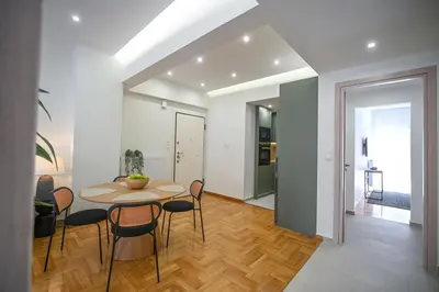 a dining room with a table and chairs at LIV - Marvelous Apartment Near Acropolis in Athens