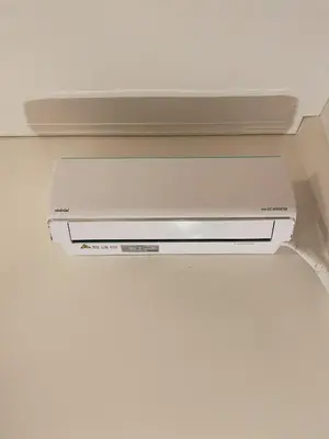 a dvd player is hanging from a ceiling at Bluebay Cozy Aparment 8 in Athens