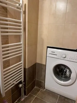 a washer and dryer in a small bathroom at Bluebay comfort apartment 18 in Athens