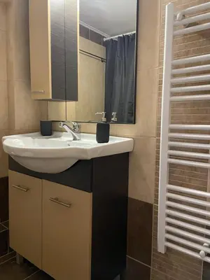 a bathroom with a sink and a mirror at Bluebay comfort apartment 18 in Athens