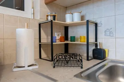 a kitchen with a sink and a shelf with a candle at Artistic 2bedroom Luxury Hop to Acropolis in Athens