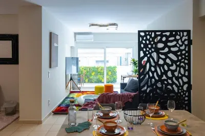 a living room with a table with plates on it at Artistic 2bedroom Luxury Hop to Acropolis in Athens
