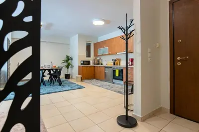 a kitchen and dining room with a table in a room at Artistic 2bedroom Luxury Hop to Acropolis in Athens
