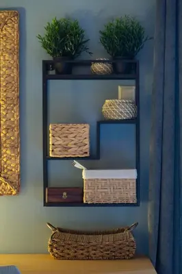 a shelf with baskets and plants on a wall at 65m2 Apt 10 min on Foot From Acropolis in Athens