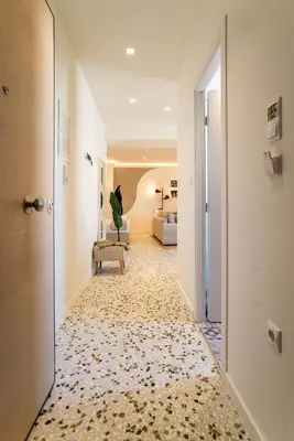 a corridor of a hotel room with a hallway at Queen Mary Psyri in Athens