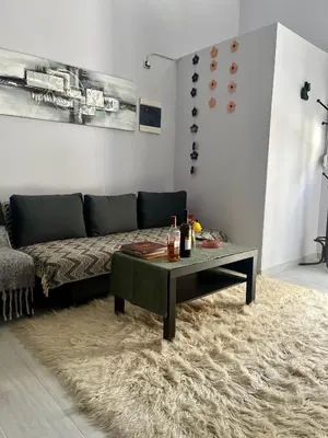 a living room with a couch and a coffee table at Chic & Cozy Apartment in Gazi, Athens in Athens