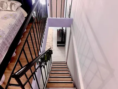 a stairway leading up to a room with a bed at Chic & Cozy Apartment in Gazi, Athens in Athens