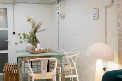 a dining room with a table with chairs and a lamp at 3Bed Loft 500m from Monastiraki Sq in Athens