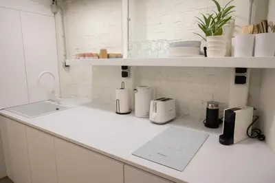 a white kitchen counter with appliances on a shelf at 3Bed Loft 500m from Monastiraki Sq in Athens