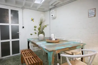 a dining room with a blue table and chairs at 3Bed Loft 500m from Monastiraki Sq in Athens