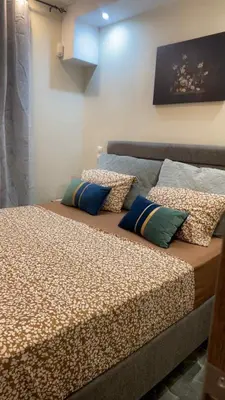 two beds sitting next to each other in a room at Kallithea Rent in Athens