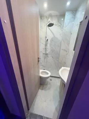 a bathroom with a toilet and a sink at Kallithea Rent in Athens