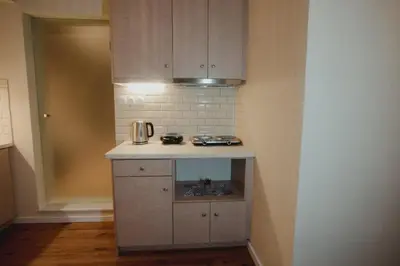 a small kitchen with a counter and a stove at Andromeda 102 apartments in Spáta