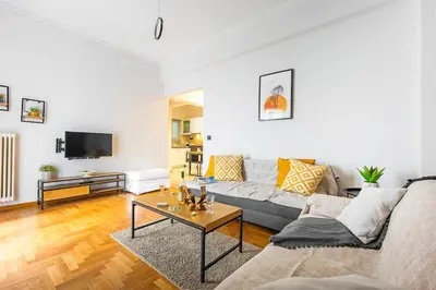 a living room with a couch and a table at Cozy Pangrati Hideaway in Athens