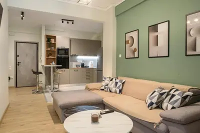 a living room with a couch and a table at Modern Flat in Exarchia in Athens