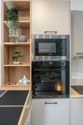 a kitchen with a microwave and a oven at Modern Flat in Exarchia in Athens