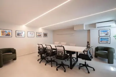 a conference room with a long table and chairs at Silk Athens Urban Collection in Athens