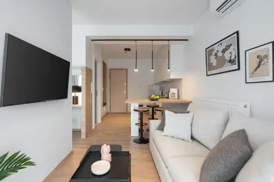 a living room with a couch and a table at Silk Athens Urban Collection in Athens