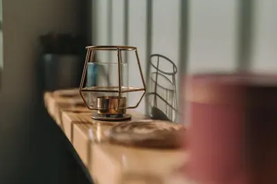 a candle holder on a table with a glass at Palm & Spa in Barbaliáki