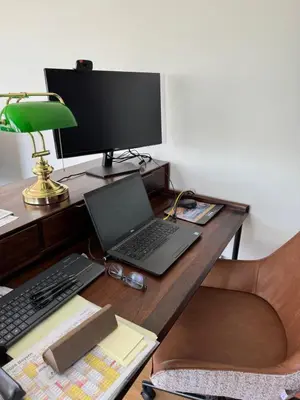 a desk with a laptop and a computer monitor at Glyfada Gorgeous Penthouse in Athens