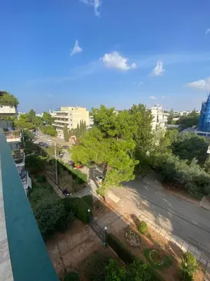 an aerial view of a city street with trees at Glyfada Gorgeous Penthouse in Athens