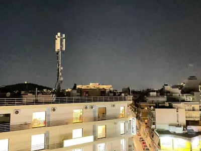 a view of a building in a city at night at Bluebay Acropolis view comfort apartment 8 in Athens