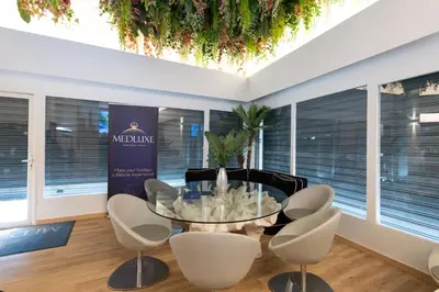 a dining room with a glass table and chairs at Medluxe family apartment! in Athens