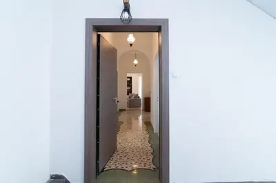 a hallway leading into a house with a mirror at Sunrise Apartment By Athens Airport in Spáta