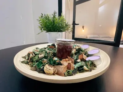 a plate of food on a table with a drink at Bluebay Cozy apartment 18 in Athens