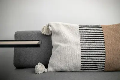 a pillow sitting on top of a couch at Sway - Chic 1-Bedroom Apartment & Balcony in Athens in Athens