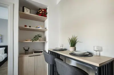 a dining room with a table and chairs at Sway - Chic 1-Bedroom Apartment & Balcony in Athens in Athens