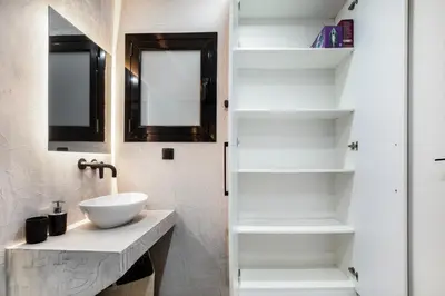 a bathroom with a sink and a mirror at Sway - Chic 1-Bedroom Apartment & Balcony in Athens in Athens