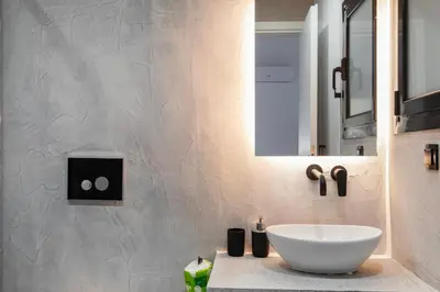 a bathroom with a white sink and a mirror at Sway - Chic 1-Bedroom Apartment & Balcony in Athens in Athens
