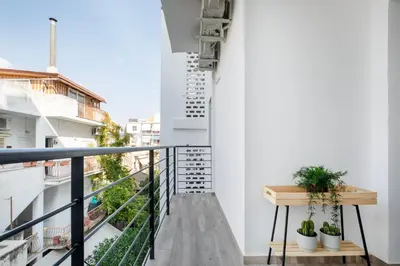 a balcony with a table and plants on it at Sway - Chic 1-Bedroom Apartment & Balcony in Athens in Athens