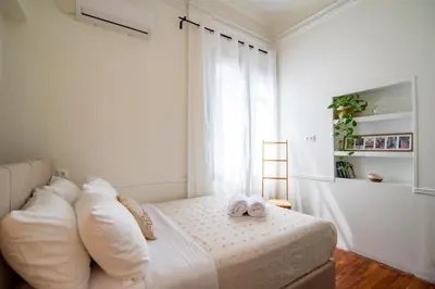 a bedroom with a bed with two towels on it at Acropolis Rooftop Ermou in Athens