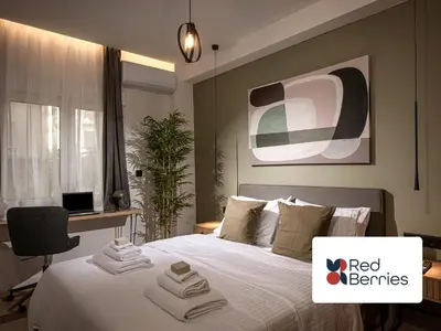 a bedroom with a bed with towels on it at Asty60 - Cozy Athen's Apartment in Athens