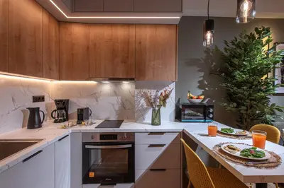 a kitchen with a christmas tree in the background at Asty60 - Cozy Athen's Apartment in Athens