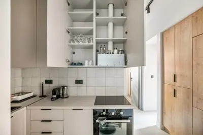 a kitchen with white cabinets and white appliances at Belmont - 2 BR Apartment & Balcony in Athens in Athens