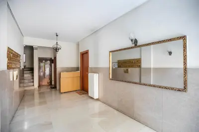 a hallway with a mirror on a wall at Belmont - 2 BR Apartment & Balcony in Athens in Athens