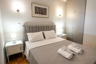 a bedroom with a bed with towels on it at Cozy Nest, One-Bedroom Flat in Athens